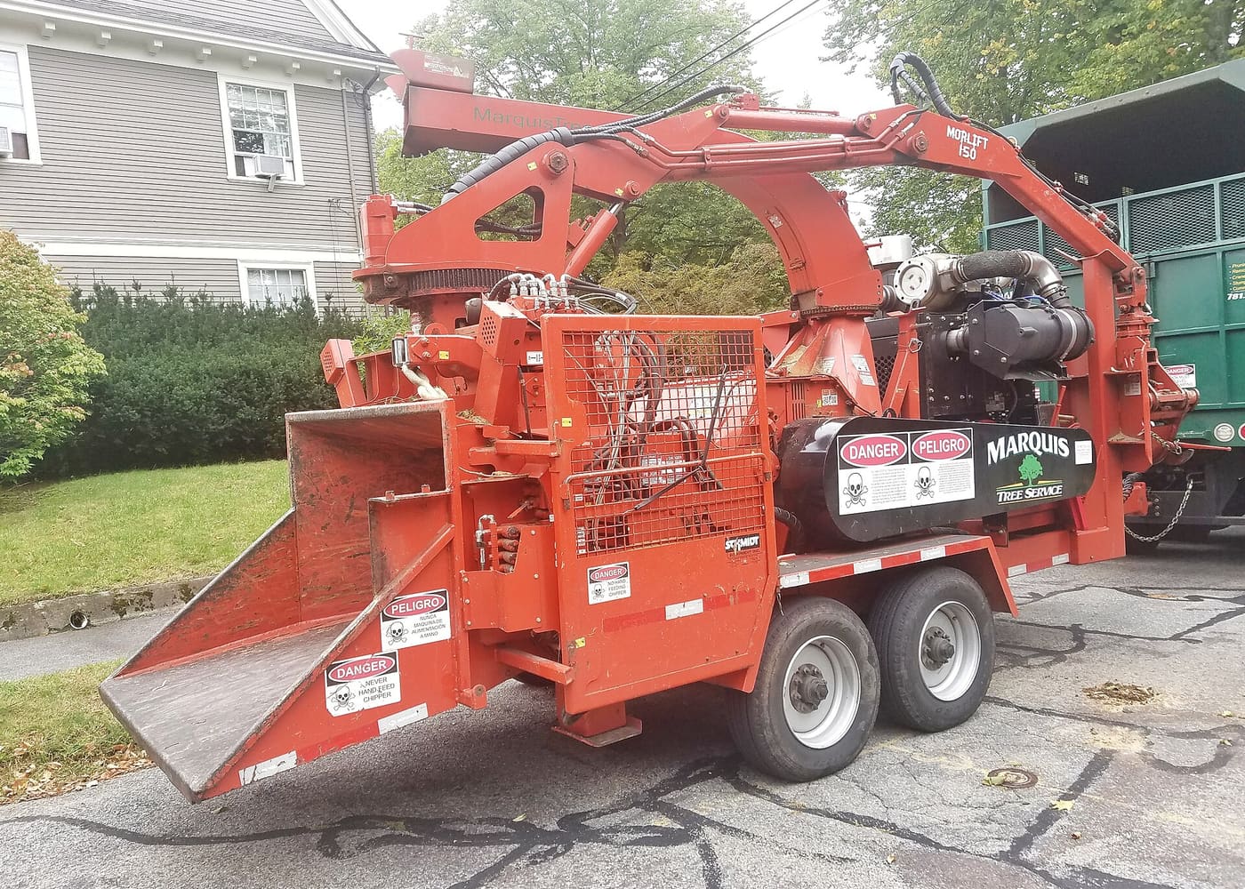 A mobile wood chipper staged for debris processing